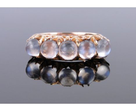 A 5 stone moonstone set ring,
unmarked high carat gold settings, setting width 22mm, size K/L.