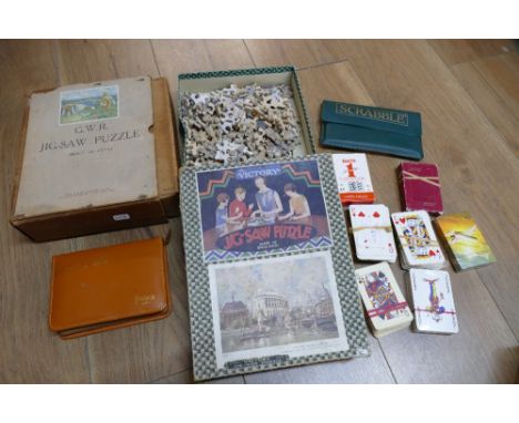 Vintage jigsaw puzzles, travelling chess set, travelling Scrabble and playing cards etc including The Victory puzzle and GWR 