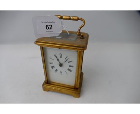 Small brass carriage clock with French movement and key, height 14 cm