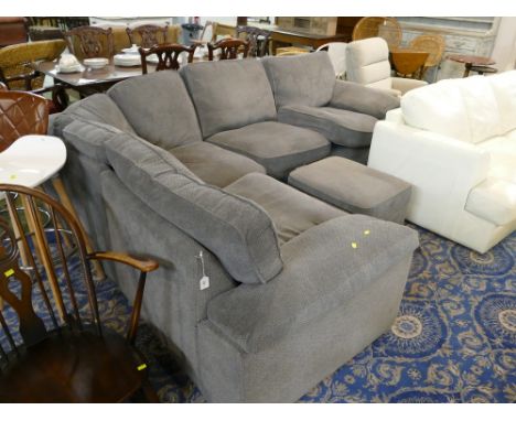 Substantial grey upholstered L shaped sofa with matching footstool 