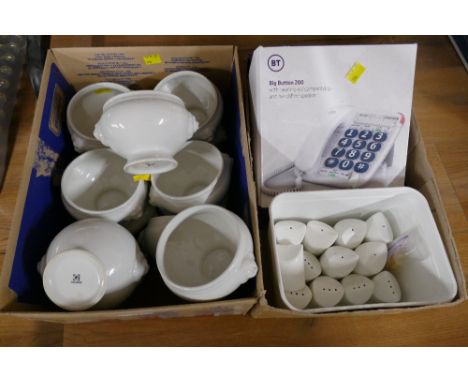 Two boxes of white ceramic pedestal dishes with lion faces, big button telephone and salt and pepper pots
