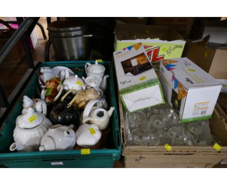 Three boxes of glassware, ornamental teapots, outdoor lighting and metal cookware