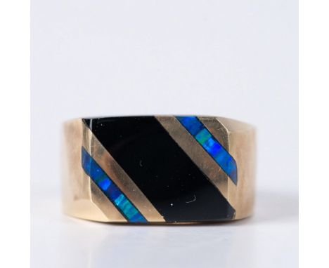 Pale 14k yellow gold ring inlaid with opal and onyx. Illegible hallmarks inside the band. Size 8.5. 10g total weight. It come