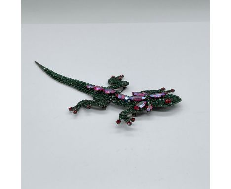 This iconic brooch is created out of green crystals. It has red accent crystals on it's back and toes. Butler and Wilson back