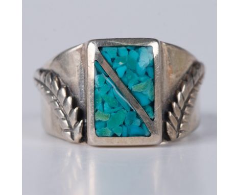 Gorgeous sterling silver ring with a raised feather design and turquoise chips. Illegible hallmark inside the band. Size 8.75