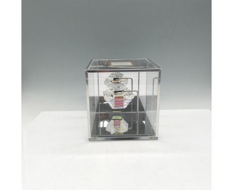Tresor perfume bottle is cut crystal and was a limited-edition of 2500 pieces. Bottle is set in a mirrored box with metal hol