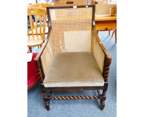 A stained beech barley-twist and bobbin turned bergere armchair