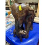 A hardwood model of mother and baby elephant