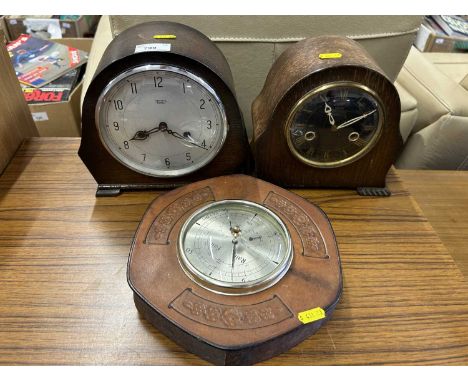 Two mantel clocks and a barometer