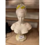 Composition bust of a young lady