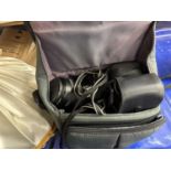A Canon EOS 620 camera together with light shades