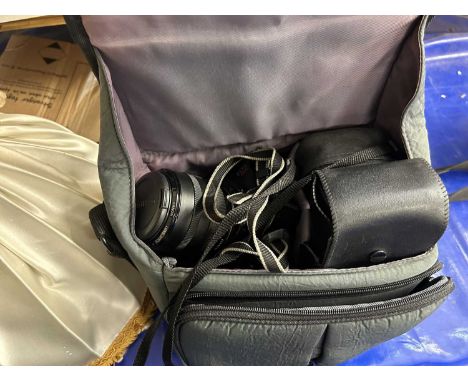 A Canon EOS 620 camera together with light shades