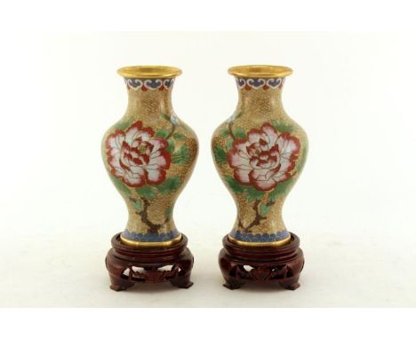 A pair of Chinese cloisonné enamel baluster vases, finely decorated with a large branch of peony and plum blossom on a beige 