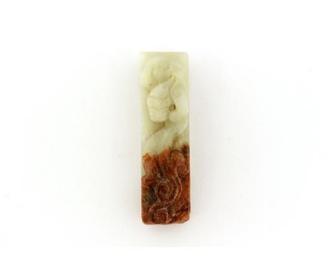 A Chinese celadon jade carving of belt buckle, decorated with the classical motif of the Chi dragon, jade one side in celadon