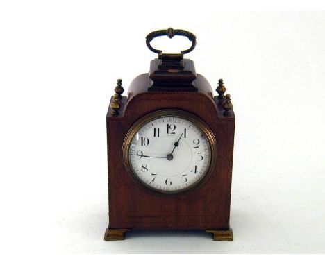 A mahogany mantel clock, the case on brass bracket feet, inlaid and herringbone stringing , brass finials, compressed  dome a