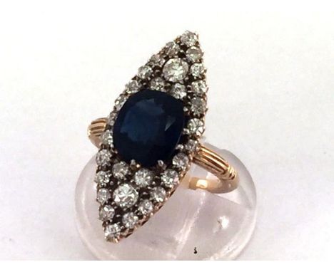 A sapphire and diamond marquise shaped cluster ring, 1920s/30s, the central rectangular cushion cut sapphire 9.1 x 8.5 x 4.1m