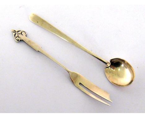 An Art Nouveau silver pastry fork in the manner of Archibald Knox, by Liberty & Co. Birmingham 1927, and an Arts and Crafts s