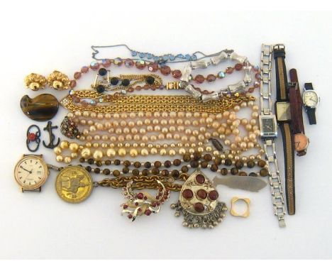 A mixed lot of costume jewellery, including simulated beads, quartz lady's watches, a Timex automatic watch, brooches, and ne