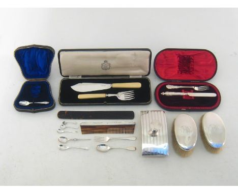 A mixed group of silver comprising:- a silver desk blotter, Birmingham, 1919; a pair of gentleman's oval brushes, inscribed "