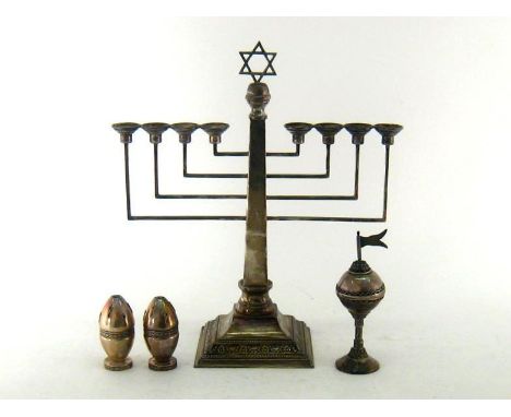 A silver menorah (lacking auxiliary light at front), London, 1955; a small Israeli white metal spice tower with flag finial  