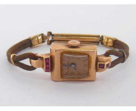 Bulova, a 1950s lady's 14 carat rose gold manual wind wristwatch, no.233136, the gilt dial with baton and dot markers, the 17