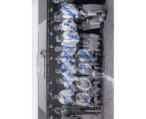 DERBY COUNTRY 1975       B/W 12” x 8” photo, showing Derby County players posing with the First Div. Trophy before a packed B