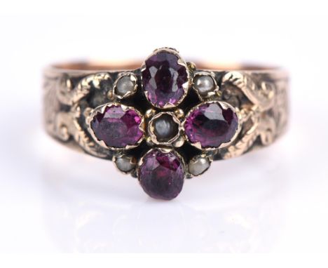Antique garnet and pearl ring, with floral motif of oval cut garnets and pearls in a closed back setting with detailed should
