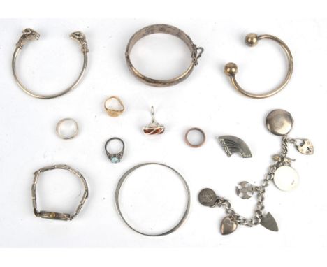 A group of jewellery, including a mis-shapen 9 ct gold signet ring, Silver charm bracelet, with seven charms, Art deco silver