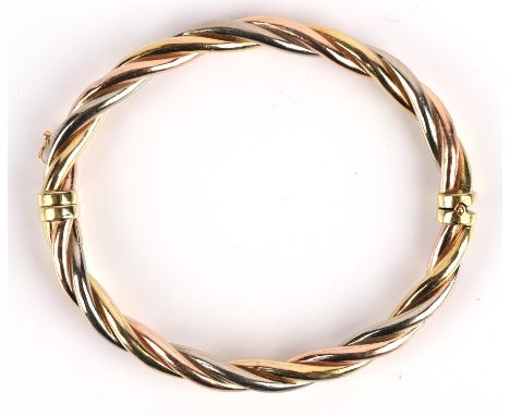 Tri coloured gold oval hinged bangle, with sprung hinge and figure of eight safety catch, stamped 14 ct Condition Report:  gr