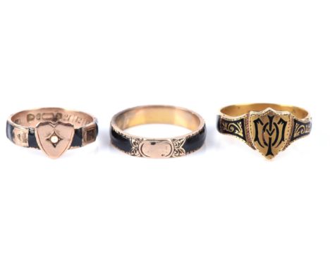 Three antique enamel rings, one in 15 ct with shield detailing, size Q, one in 9 ct with heart detail set with a seed pearl, 