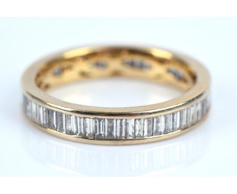 Diamond full eternity ring, set with baguette cut diamonds to the whole band, in stamped 18 ct, size NCondition Report:  gros