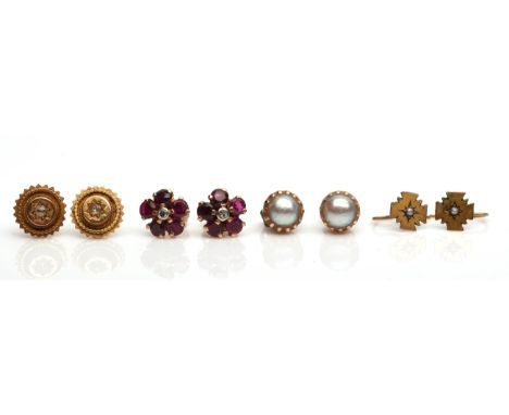 Four pairs of earrings including a pair gypsy set with diamonds, a pair of pearl studs, a pair of ruby and diamond floral stu