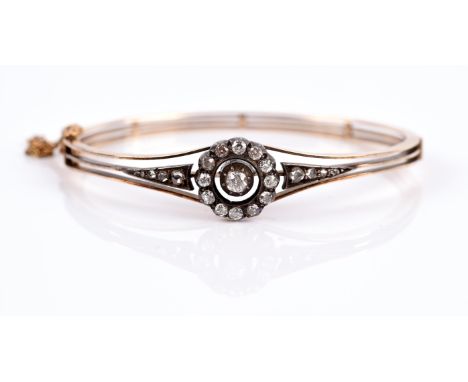 Victorian diamond bangle, with floral motif set with old cut diamonds, flanked either side by graduating rose cut diamonds, i