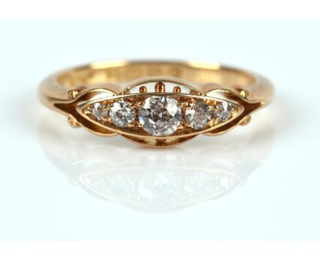 Antique five stone diamond ring, with old cut diamonds set with openwork details to each edge, in 18 ct yellow gold, hallmark