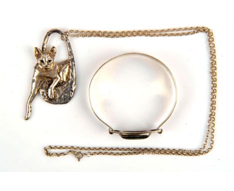 Silver cat pendant by Donald W. Kendall, hallmarked London 1990, with makers mark DWK, pendant measuring 6.9 x 3.5cm on a bel