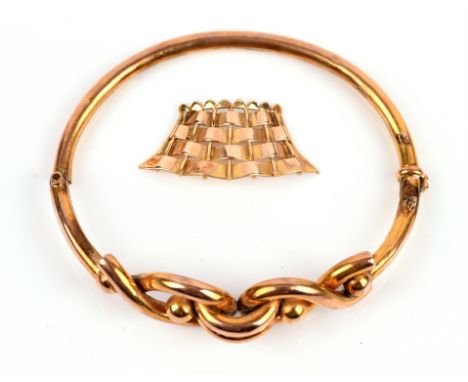 A bangle with openwork top, stamped 9 ct, with broken hinge, together with a loose piece of gold testing as 9 ctCondition Rep
