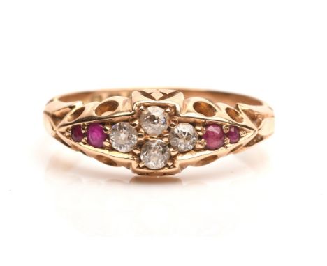 Ruby and diamond ring, with four old cut diamonds set to the centre, and two round cut rubies on either side, with openwork s