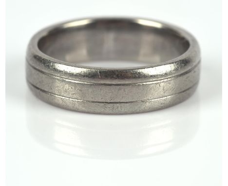 AMENDED ESTIMATE Palladium wedding band, 5.7mm with engraved line detail, inside band marked Pd for palladium, ring size PCon