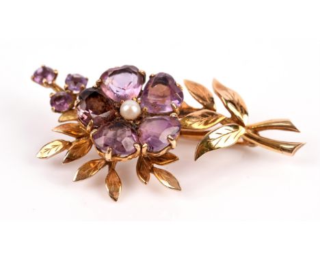 1960's amethyst and pearl flower brooch, flower petals comprised of five heart cut amethysts, with a pearl set to the centre,