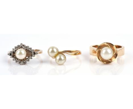 Three pearl rings, including a two pearl crossover ring, size M and a pearl and diamond ring, size N1/2, both in 9 ct, togeth