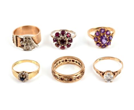 Six gem set rings including two 18 ct rings, one a sapphire and diamond cluster ring, size L, the other a ruby cluster ring, 