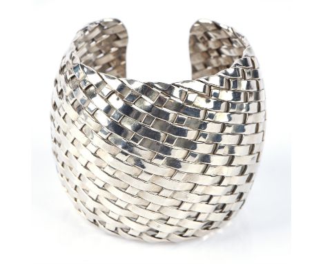 Modern silver cuff, woven design open bangle measuring 50mmin diameter, inside diameter 46mmCondition Report:  Gross weight 8