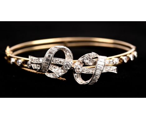 Diamond bow hinged bangle, set with round brilliant cut, single cut and baguette cut diamonds, mount testing as 14 ct and pla