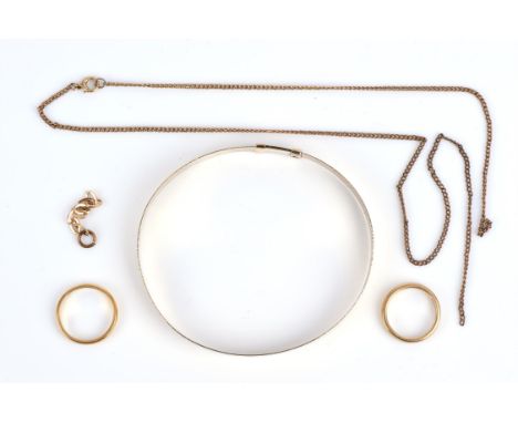 A group of gold jewellery, including an oval sliding bangle, testing as 14 ct, a 18 ct wedding band, ring size G, 22 ct weddi