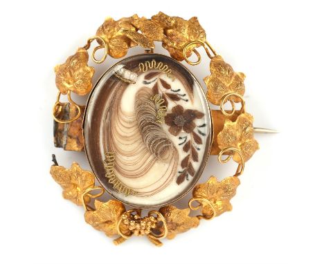 Leaf mourning brooch, with hairwork centre and surround of leaf motifs grapes and a bird, with glazed panel to the reverse, i