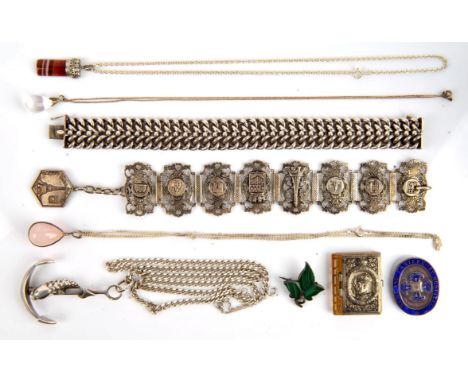 A group of silver items, including an antique malachite ivy brooch, a fancy link silver bracelet, rock crystal pool of light 