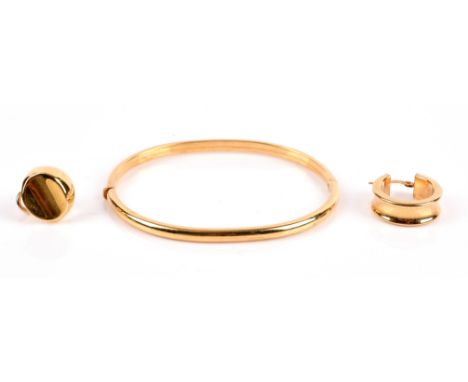 A gold hinged bangle, width 3.5mm, inside diameter 64x52mm, together with two single earrings, all in 18 ctCondition Report: 
