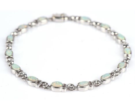 Opal bracelet, set with oval cabochon opals in a fancy link bracelet in 9 ct, with box clasp and safety clip, 18.5cm in lengt