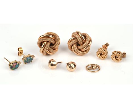 A group of earrings including two pairs of knot motif earrings in 9 ct, a gold plated pair of studs, and a gold plated pair o