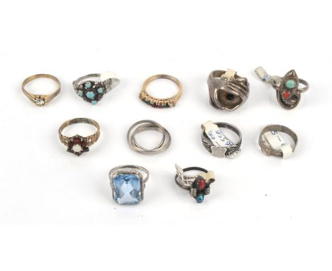 A group of silver rings including a Russian wedding band, size H, a buckle ring, size L, a garnet and opal cluster ring size 